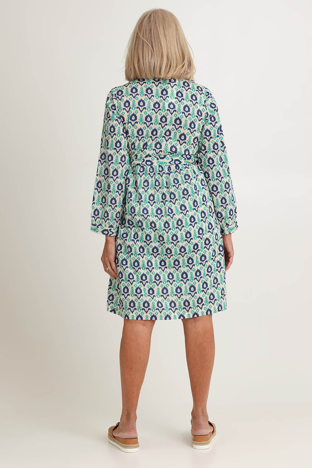 Model Sandy wearing size S of the Heidi Dress in colour Ikata, from the back
