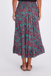 Model Alex wearing the Gigi Maxi Skirt in colour Miamiprint (Green), from the back