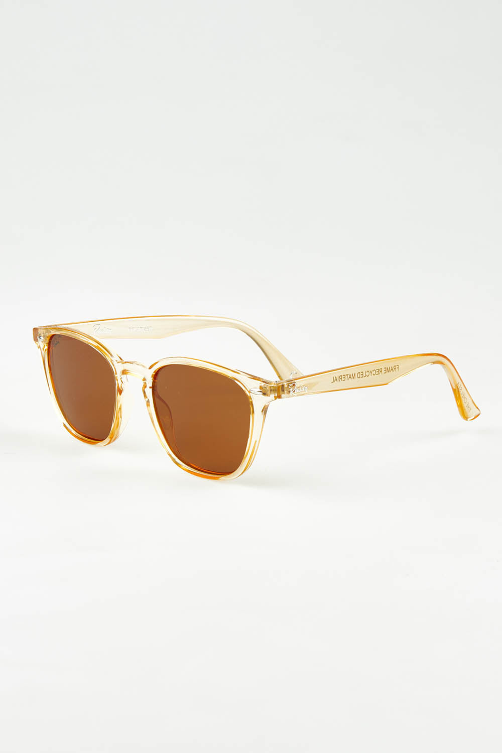 A model wearing size OneSize of The Chelsea Square Sunglasses in colour Prosecco, from the front, showing the whole outfit