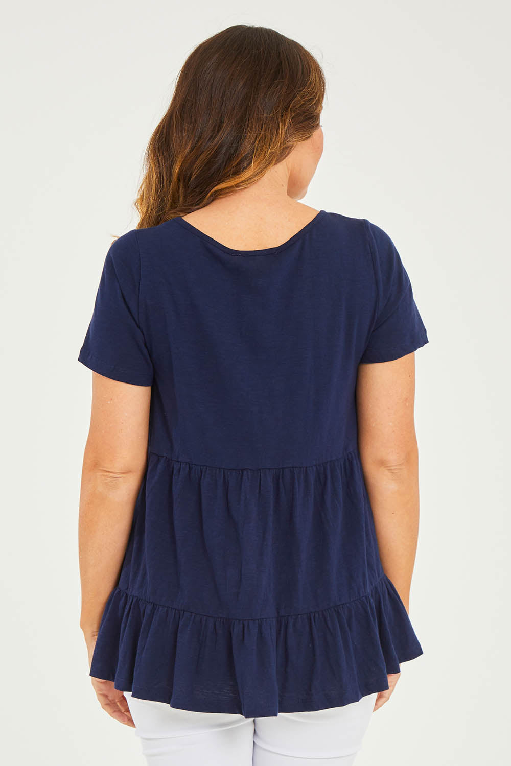 Model Georgia wearing size 10 of the Harper Layered Top in colour Navy (Blue), from the back