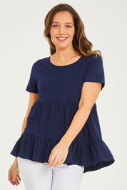Model Georgia wearing size 10 of the Harper Layered Top in colour Navy (Blue), from the front, cropped image