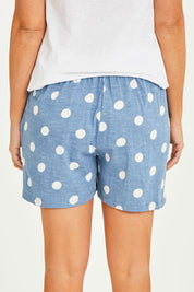 Model Georgia wearing size 10 of the Ava Cuff Short in colour Spotdenim (Blue), from the back