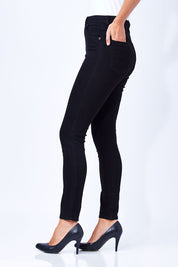Model Anna wearing size 10 of the Hi Rider Skinny Jean in colour ExBlack (Black), from the front, cropped image