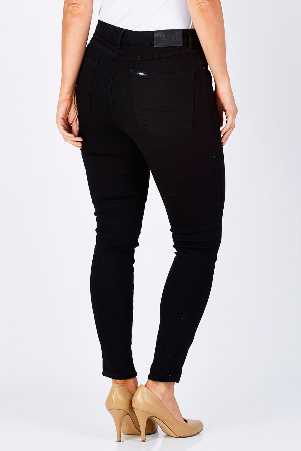 Model Laura wearing size 12 of the Hi Rider Skinny Jean in colour ExBlack (Black), from the back