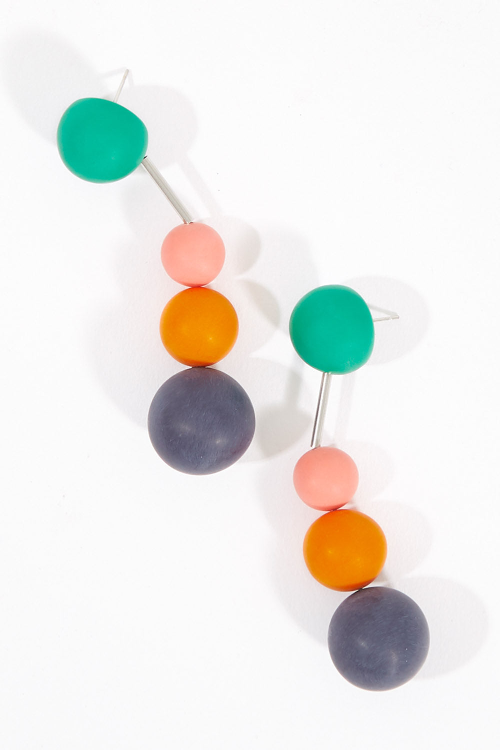 A model wearing size OneSize of the Aurora Bold Triple Drop Earrings in colour Multi (Blue), from the front, showing the whole outfit