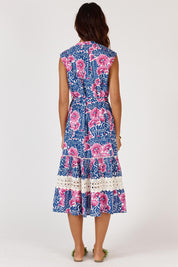 A model wearing the Catembe Cotton Midi Dress in colour Navy (Blue), from the back
