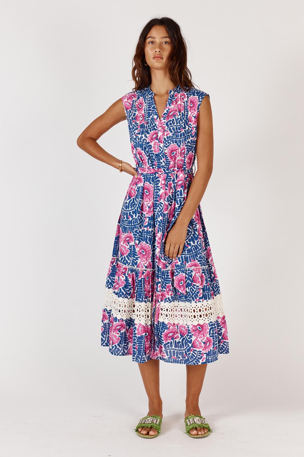 A model wearing the Catembe Cotton Midi Dress in colour Navy (Blue), from the front, showing the whole outfit
