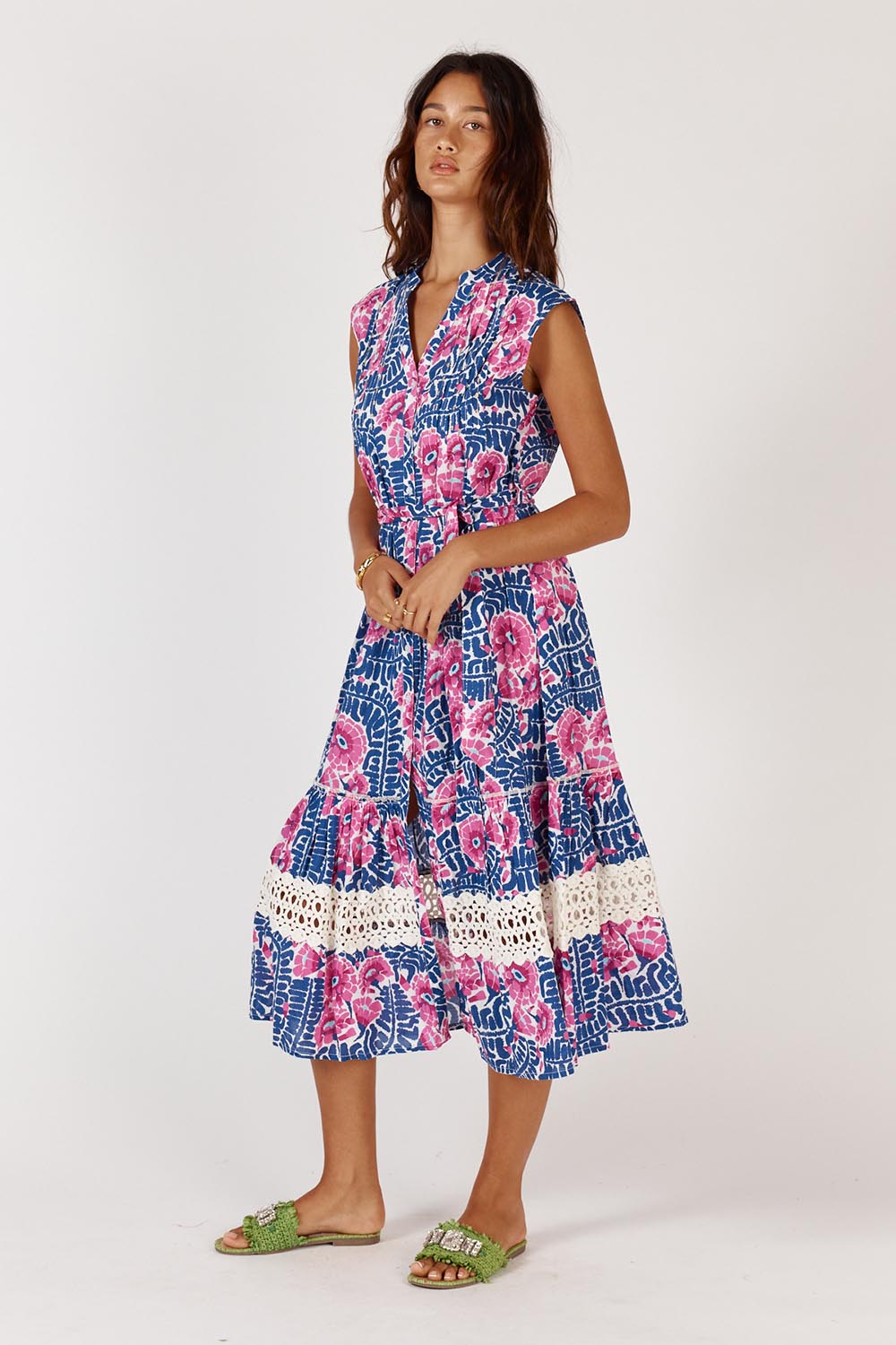 A model wearing the Catembe Cotton Midi Dress in colour Navy (Blue), from the front, showing the whole outfit