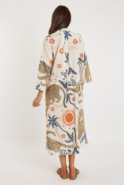 A model wearing the Celine Cotton Kaftan Dress in colour Print, from the back