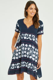 Model Madeline wearing size S of the Charlotte Dress in colour Navy (Blue), from the front, cropped image