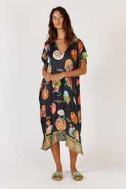 A model wearing the Down Under Kaftan in colour Black (Black), from the front, showing the whole outfit