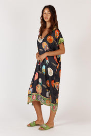A model wearing the Down Under Kaftan in colour Black (Black), from the front, showing the whole outfit