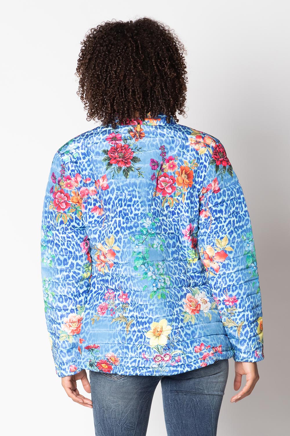 A model wearing the Florentyna Puffer Jacket in colour Blue (Blue), from the back