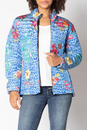 A model wearing the Florentyna Puffer Jacket in colour Blue (Blue), from the front, cropped image