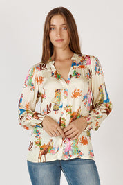 A model wearing the Gigi Shirt in colour Print, from the front, cropped image