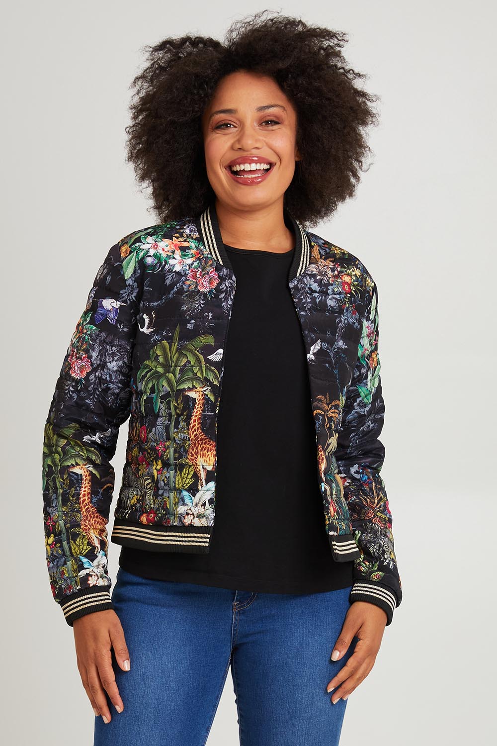 Model Olivia wearing size S of the Jungle Jacket in colour Black (Black), from the front, cropped image
