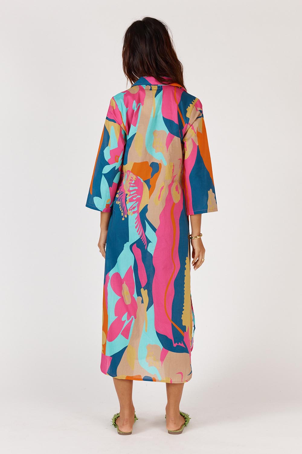 A model wearing the Lotus Bloom Cotton Midi Dress in colour Print, from the back