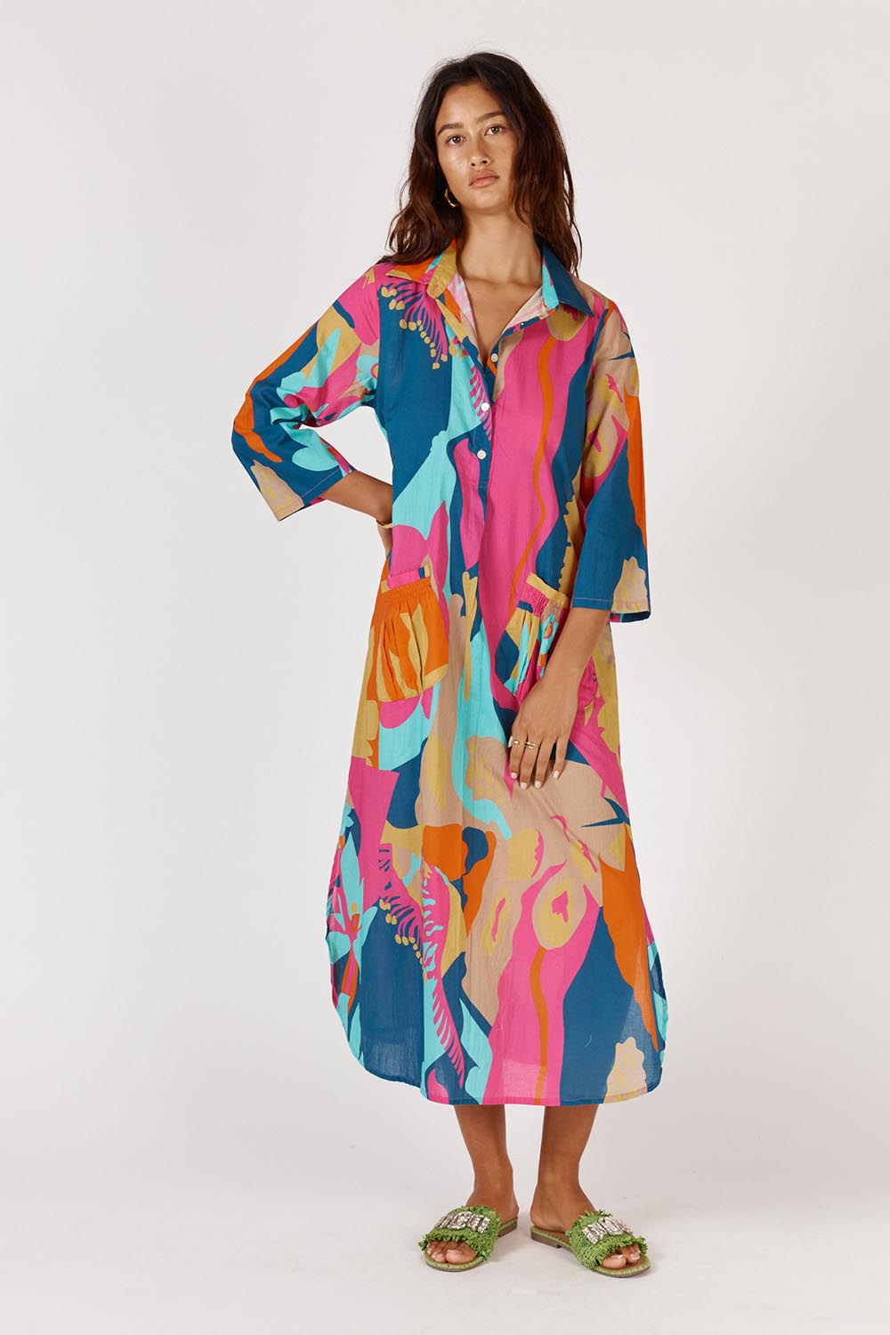 A model wearing the Lotus Bloom Cotton Midi Dress in colour Print, from the front, showing the whole outfit