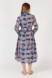 A model wearing the Maple Cotton Maxi Dress in colour Print, from the back