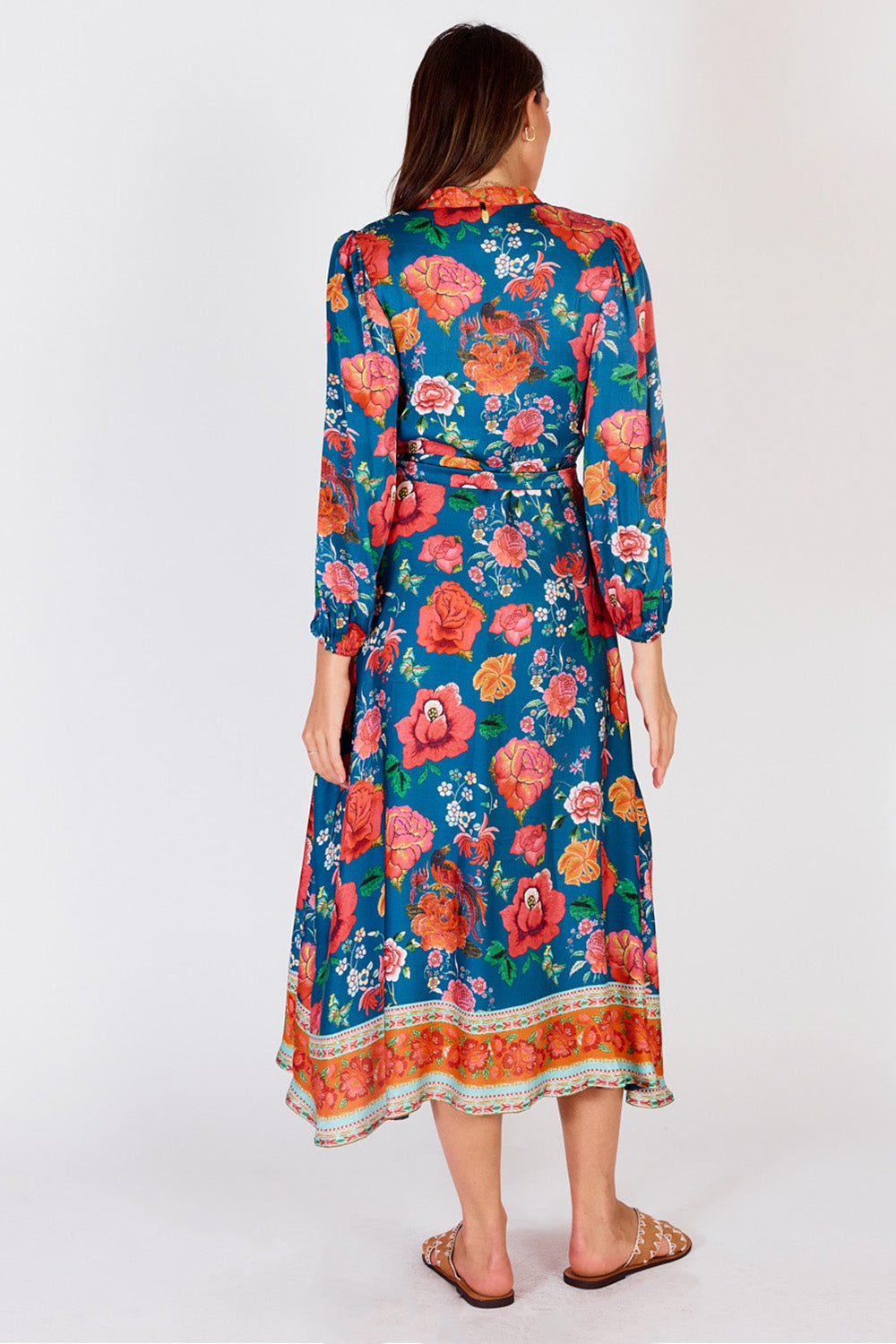 A model wearing the Mexican Flower Maxi Dress in colour Bluemulti (Blue), from the back