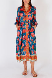 A model wearing the Mexican Flower Maxi Dress in colour Bluemulti (Blue), from the front, cropped image