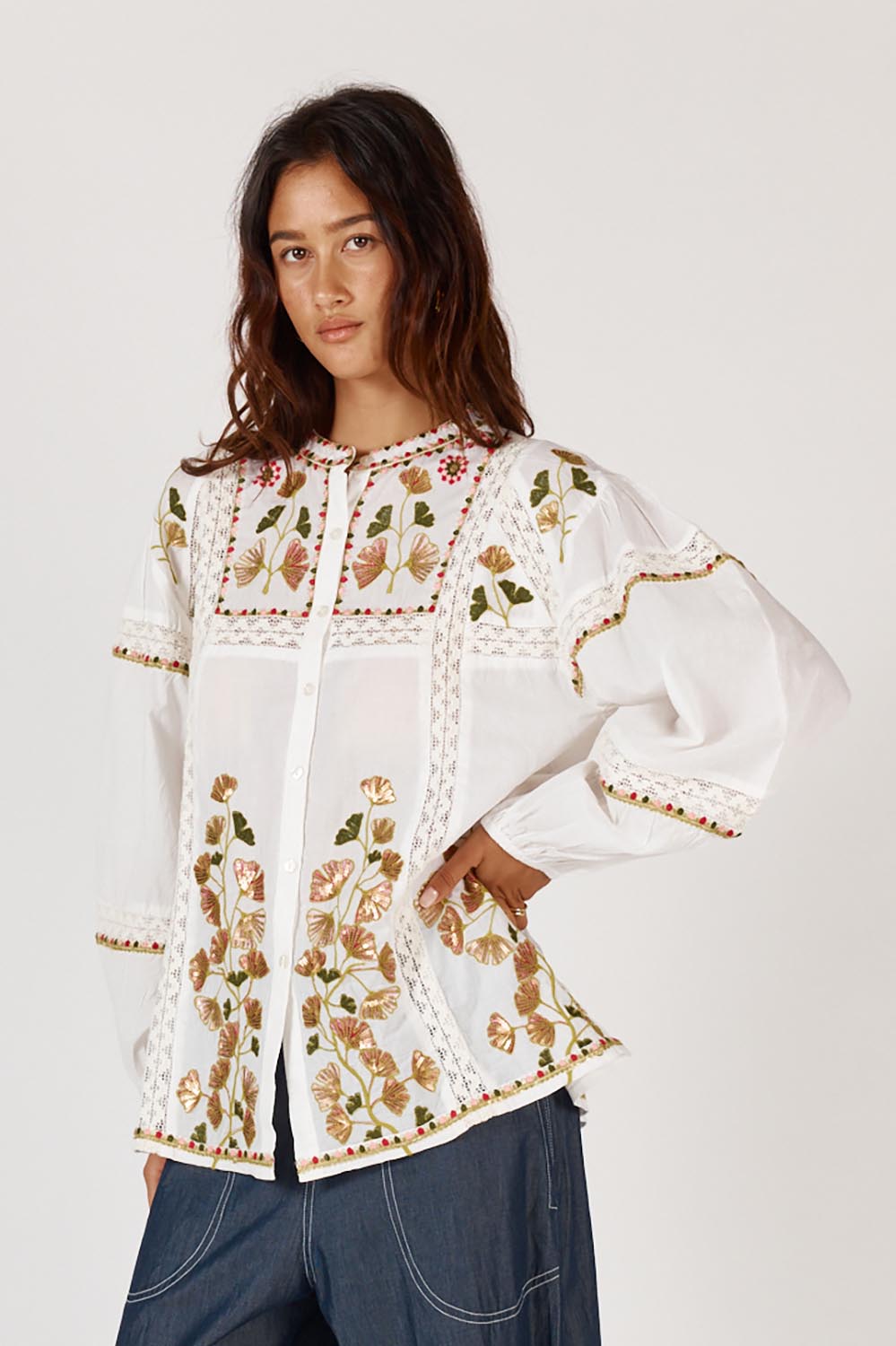 A model wearing the Monfils Cotton Top in colour White (White), from the front, cropped image