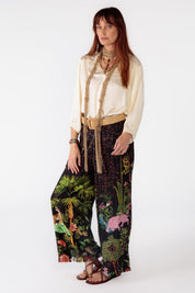 A model wearing the Nouveau Pant in colour Black (Black), from the front, showing the whole outfit