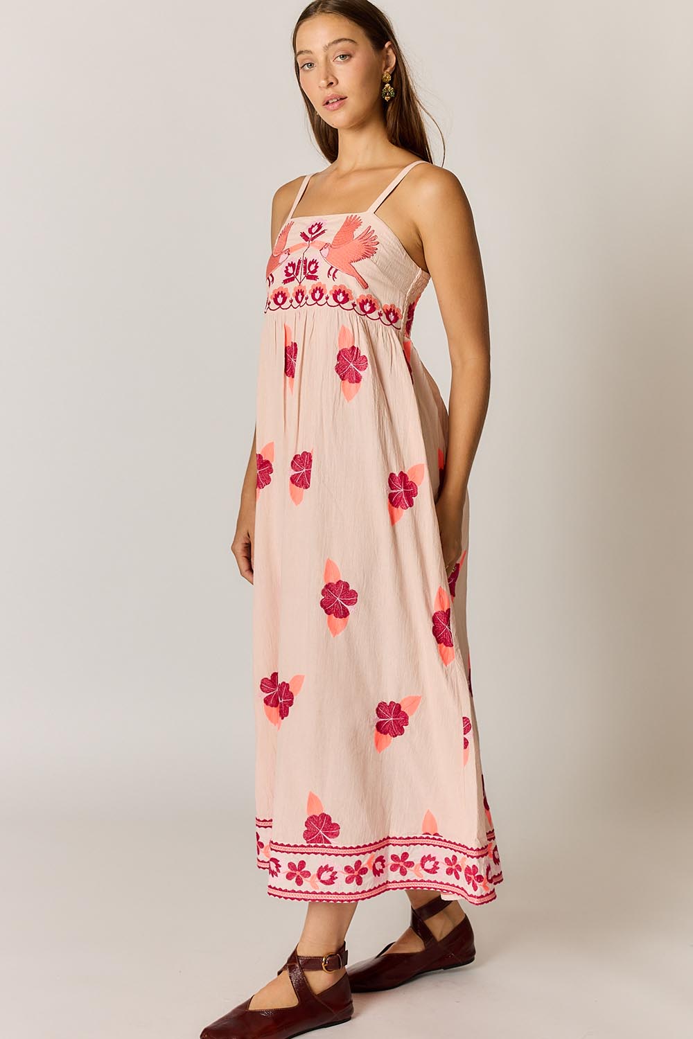 Model Genericm wearing size sample of the Palmy Sundress – Pink in colour Pink, from the front