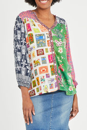 Model Aiyana wearing size S of the Destination Patch Shirt in colour Multi (Green), from the front, cropped image