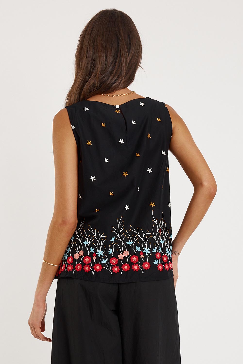 A model wearing the Provence Cotton Tank Top in colour Black (Black), from the back