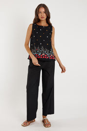 A model wearing the Provence Cotton Tank Top in colour Black (Black), from the front, showing the whole outfit