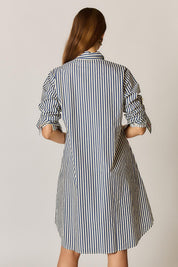 Model Genericm wearing size sample of the Sicily Dress – Print in colour Print, from the back