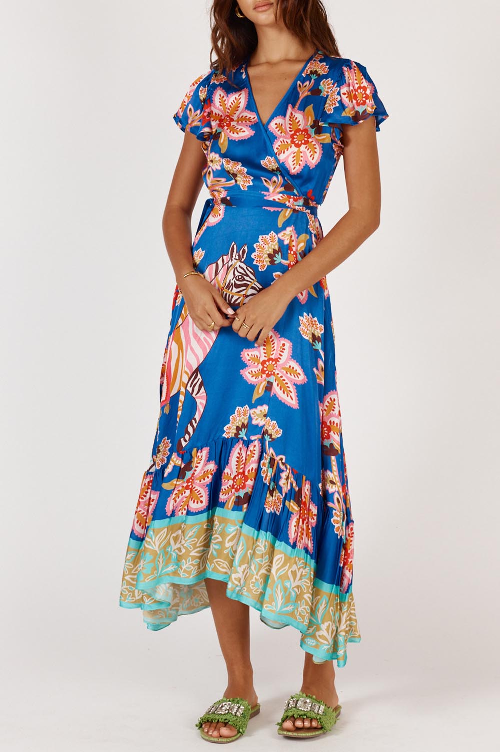 A model wearing the Tango Wrap Dress in colour Print (Blue), from the front, cropped image