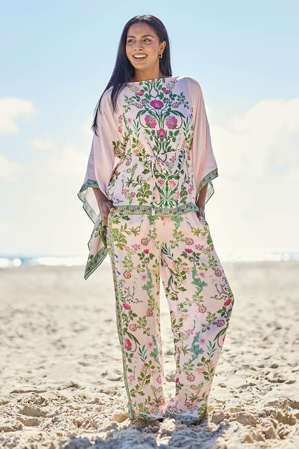 Model Eshan wearing size 10 of the Tatiana Pant – Pink in colour Pink, from the front