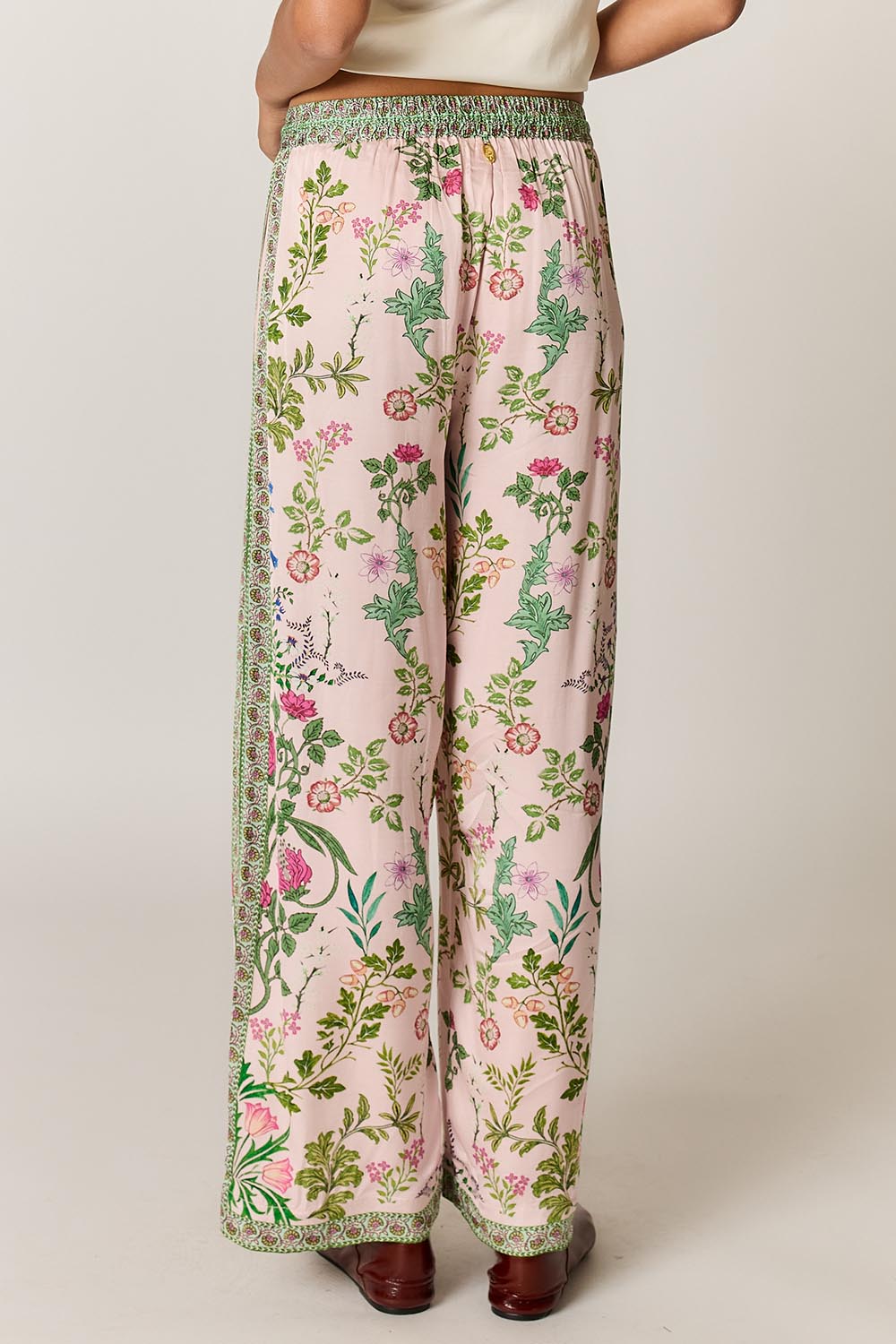 Model Genericm wearing size sample of the Tatiana Pant – Pink in colour Pink, from the back