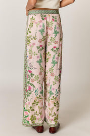 Model Genericm wearing size sample of the Tatiana Pant – Pink in colour Pink, from the back