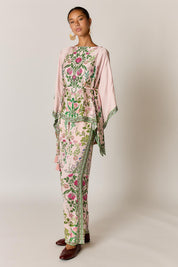Model Genericm wearing size sample of the Tatiana Poncho – Pink in colour Pink, from the front