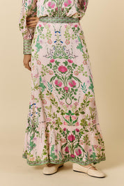 Model Genericm wearing size sample of the Tatiana Skirt – Pink in colour Pink, from an angle