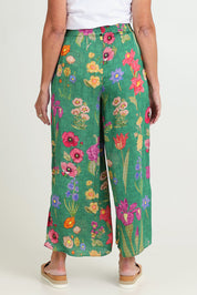 Model Sandy wearing size S of the Tea Pant in colour Emerald (Green), from the back