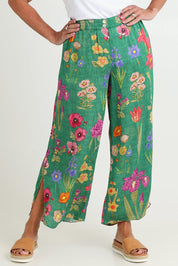 Model Sandy wearing size S of the Tea Pant in colour Emerald (Green), from the front, cropped image