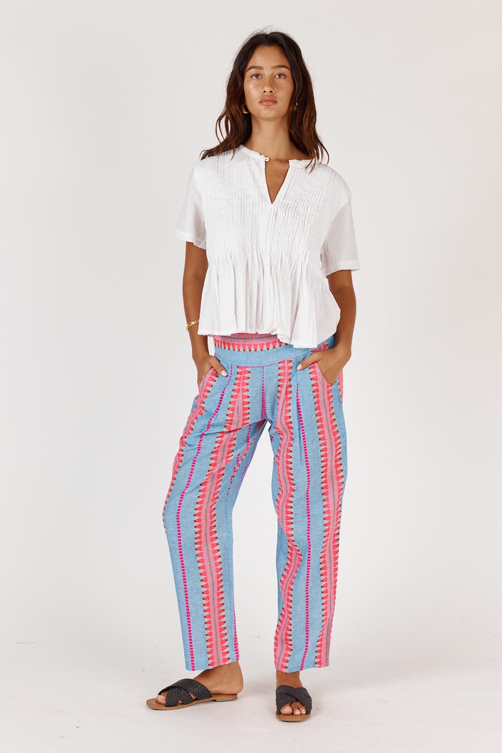 A model wearing the Vivian Cotton Top in colour White (White), from the front, showing the whole outfit