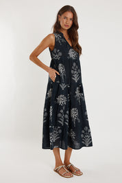 A model wearing the Waratah Cotton Dress in colour Print (Black), from the front, showing the whole outfit