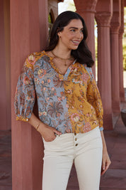 A model wearing the Willow Shirt in colour Multi, from the front, showing the whole outfit