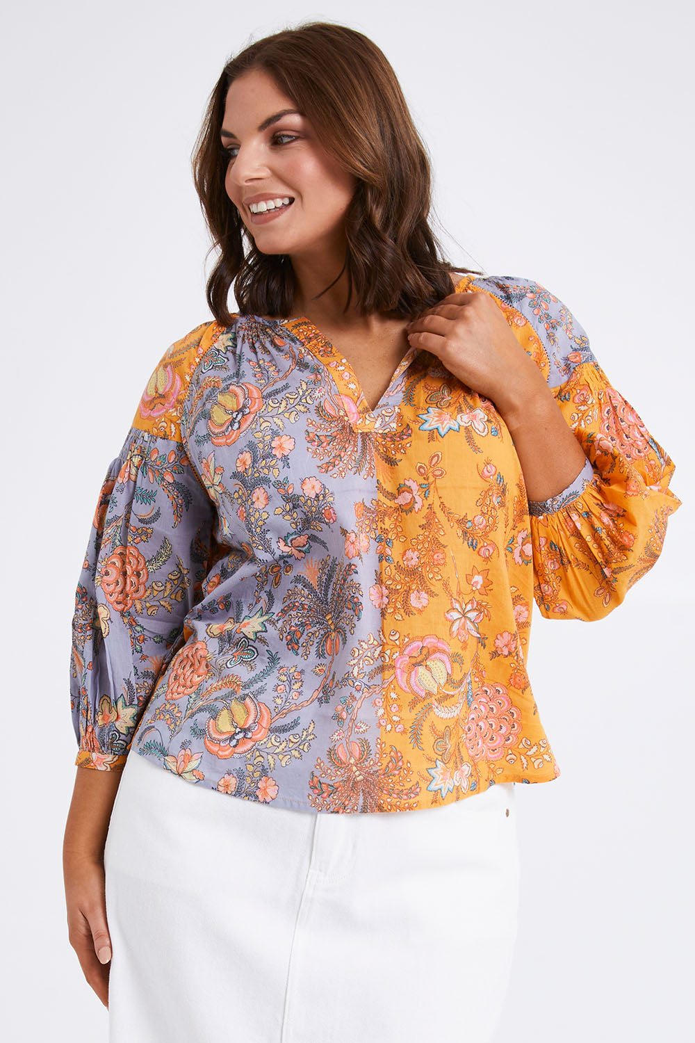 Model Monique wearing size L of the Willow Shirt in colour Multi, from the front, cropped image