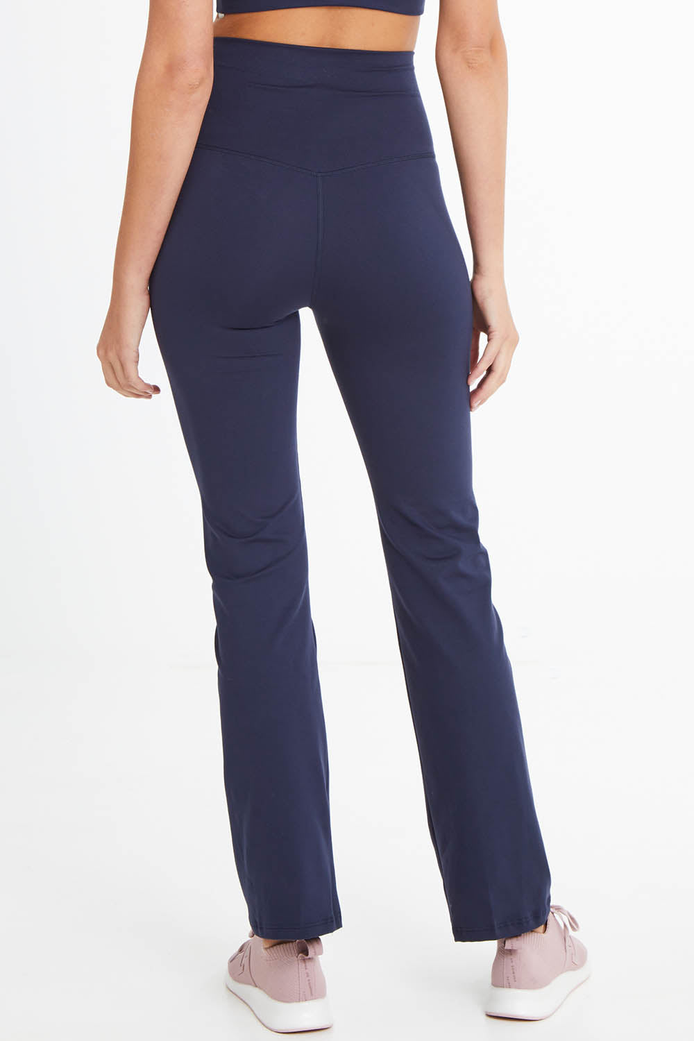 Model Madeline wearing size 10 of the Ab Tastic Peach Studio Jazz Bootleg in colour Crew (Blue), from the back