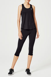 A model wearing the Back To Bare Action Bk Tank in colour Black (Black), from the front, cropped image