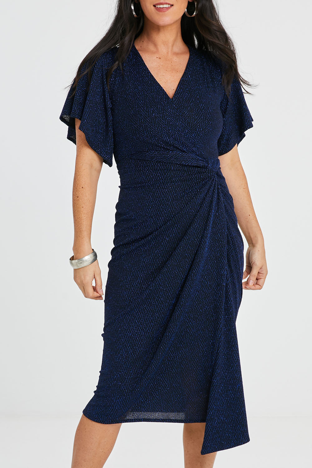 Model Katie wearing size 10 of the Emporium Dress in colour Sapphire (Blue), from the front, cropped image