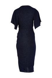Product shot of the Emporium Dress in colour Sapphire (Blue), from the back