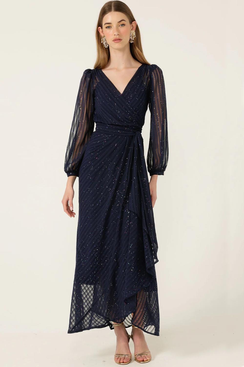A model wearing the Sierra Wrap Dress in colour Navysparkl (Blue), from the front, showing the whole outfit