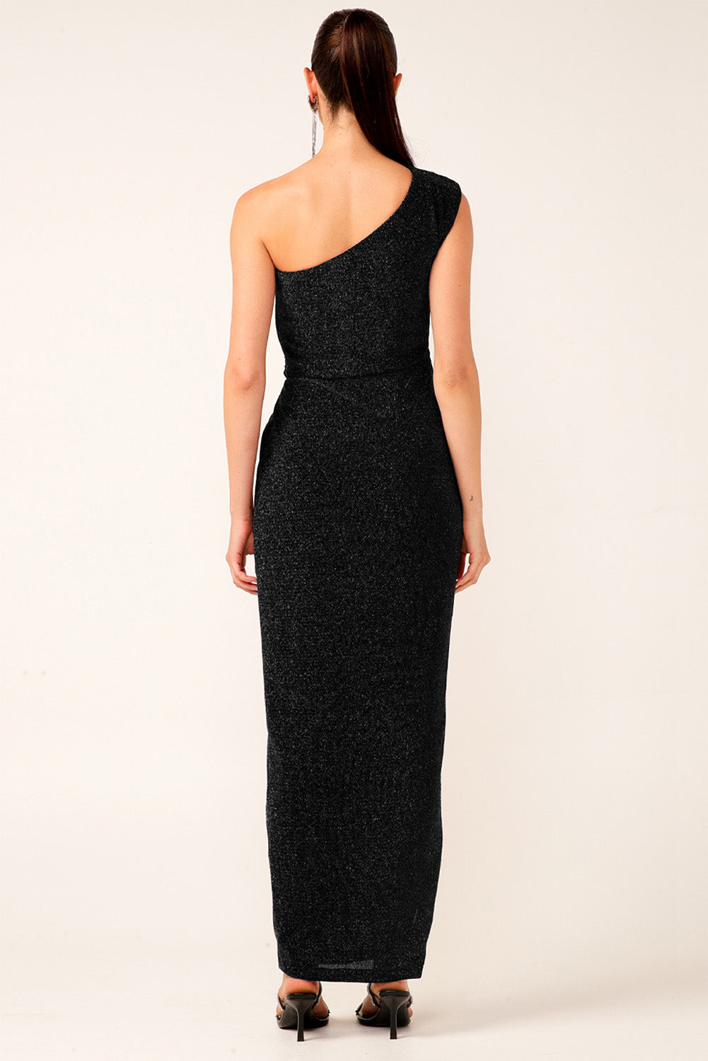 A model wearing the Valedictory Dress in colour Black (Black), from the back